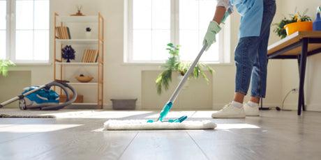 laminate flooring being cleaned with a damp mop