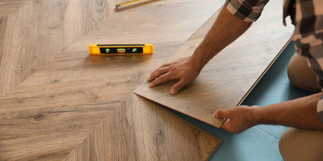 Flooring expert installing vinyl flooring