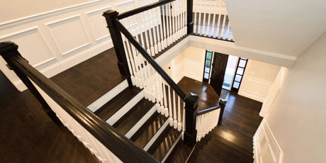 Wood floor staircase highlighting Vinyl Plank Flooring on Stairs.